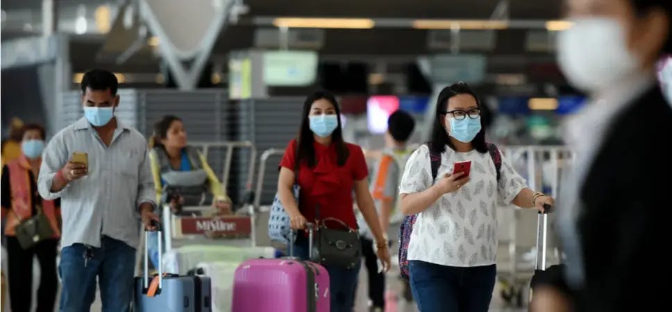 People wearing masks at an airport