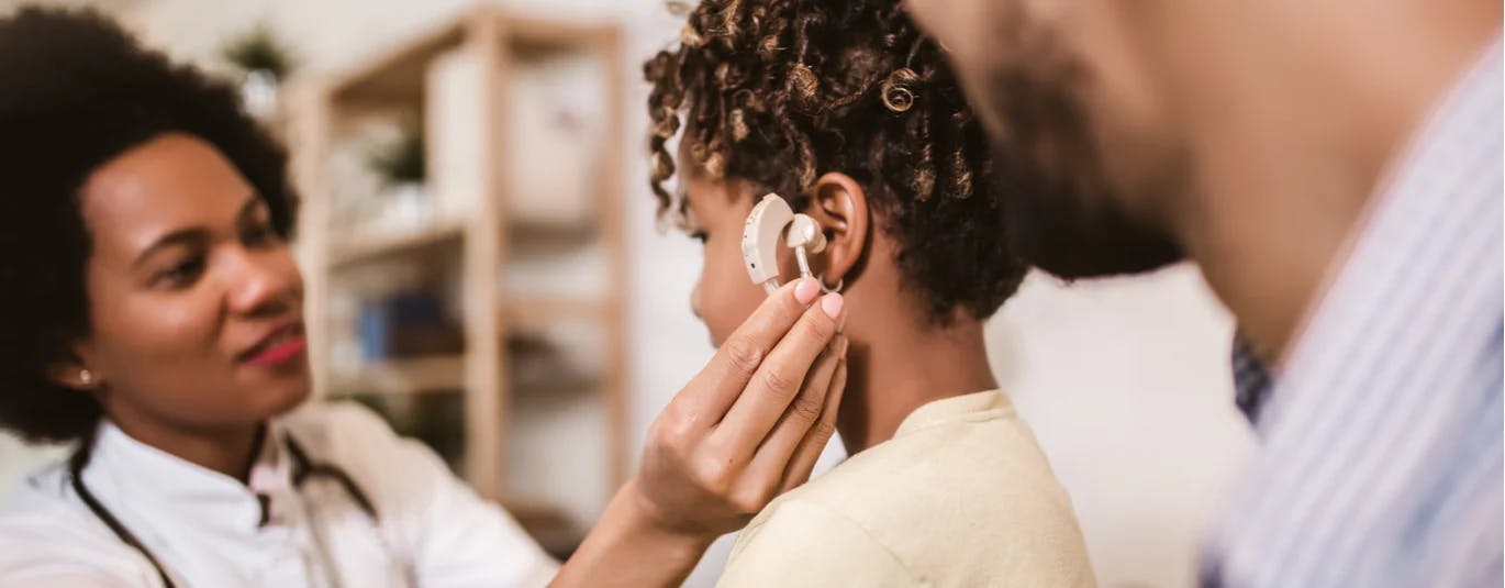 Child being fitted for hearing aids