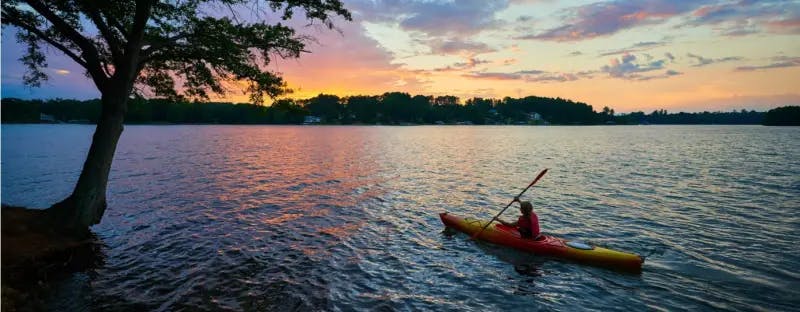 Canoe on a lake at sunset