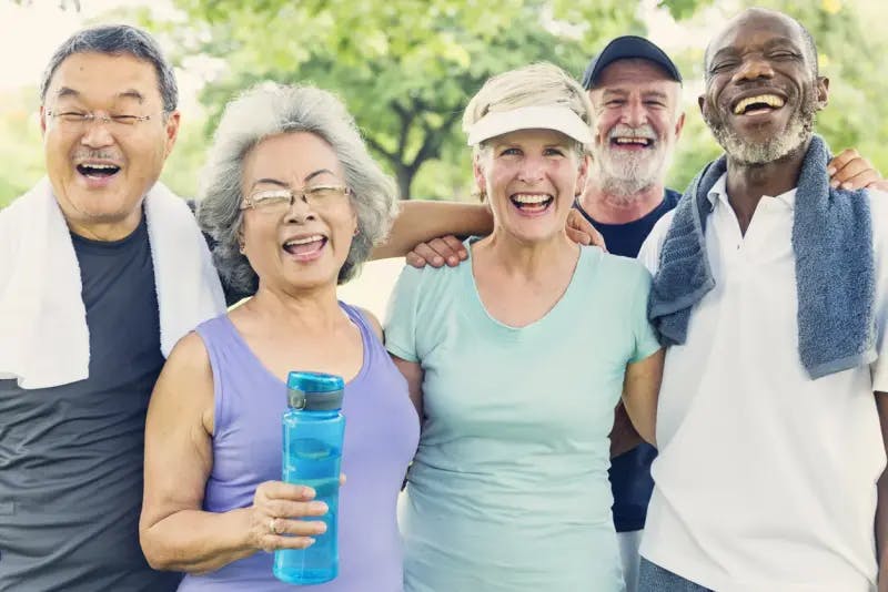 Five older people smiling after exercising