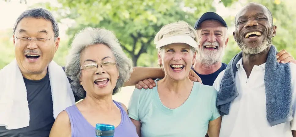 Five older people smiling after exercising