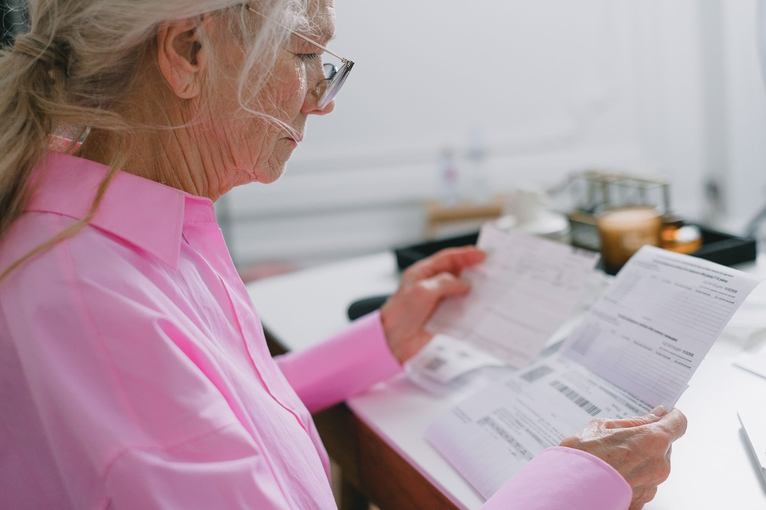 Older woman reading a document