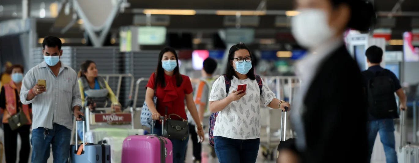 People wearing masks at an airport