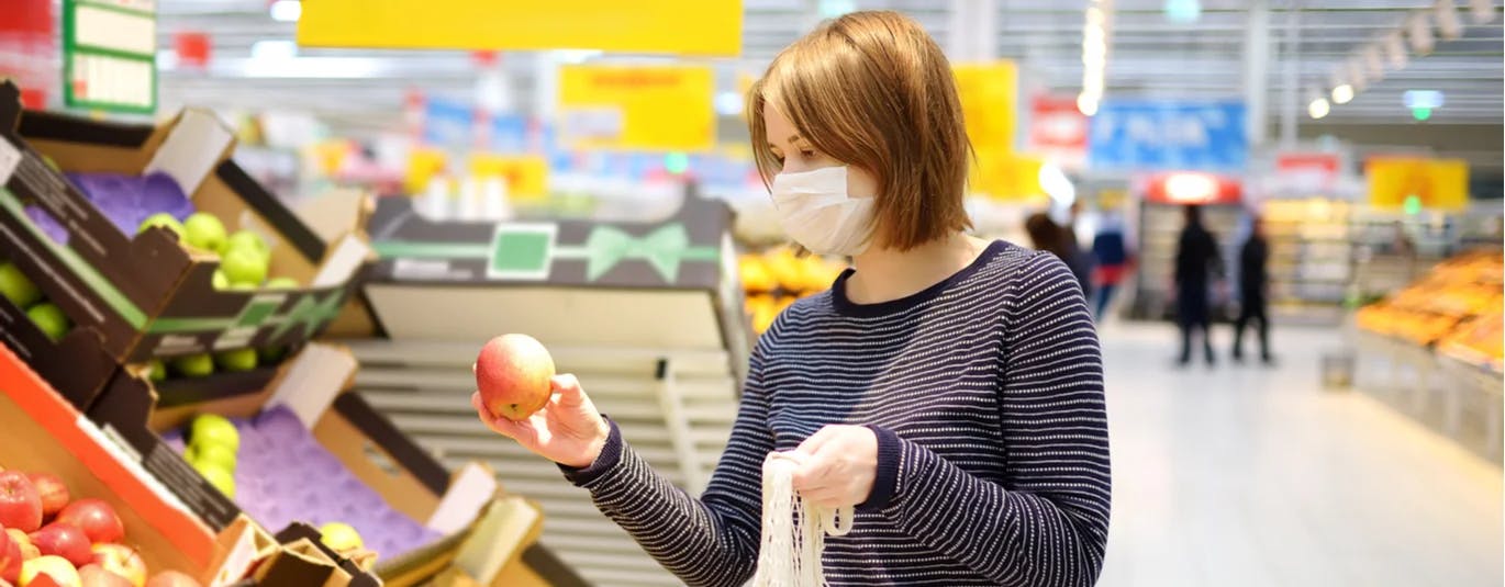 Person wearing a mask in a grocery store