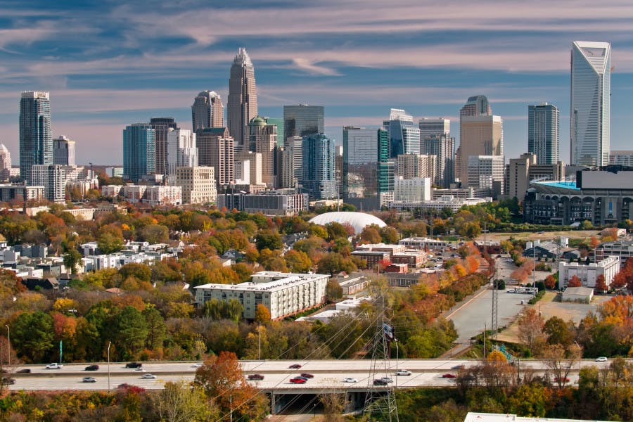 Charlotte, North Carolina, known as the "Queen City," has experienced remarkable growth, particularly in its Uptown area. Unlike typical cities where the center is called "downtown," Charlotte's central district is referred to as Uptown, reflecting its upward expansion from the lower-lying region. The Uptown skyline showcases a harmonious mix of contemporary skyscrapers and historic structures, embodying the city's unique blend of southern charm and urban sophistication. This impressive skyline is a testament to Charlotte's rapid economic development and thriving growth.