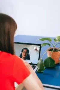 People doing a video call on a laptop