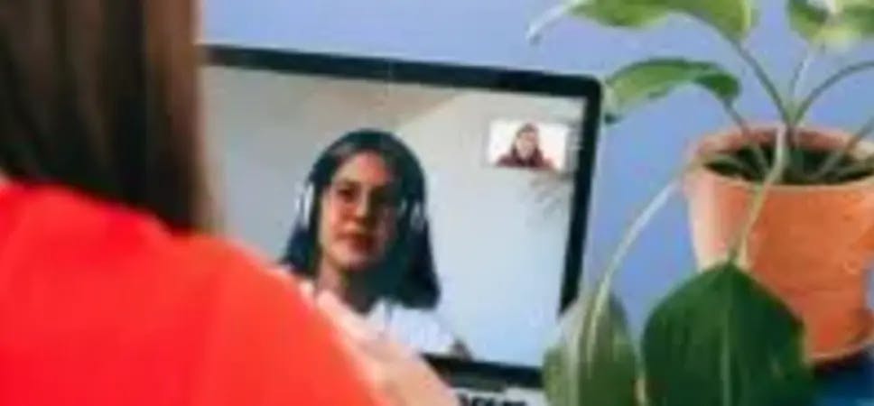 People doing a video call on a laptop