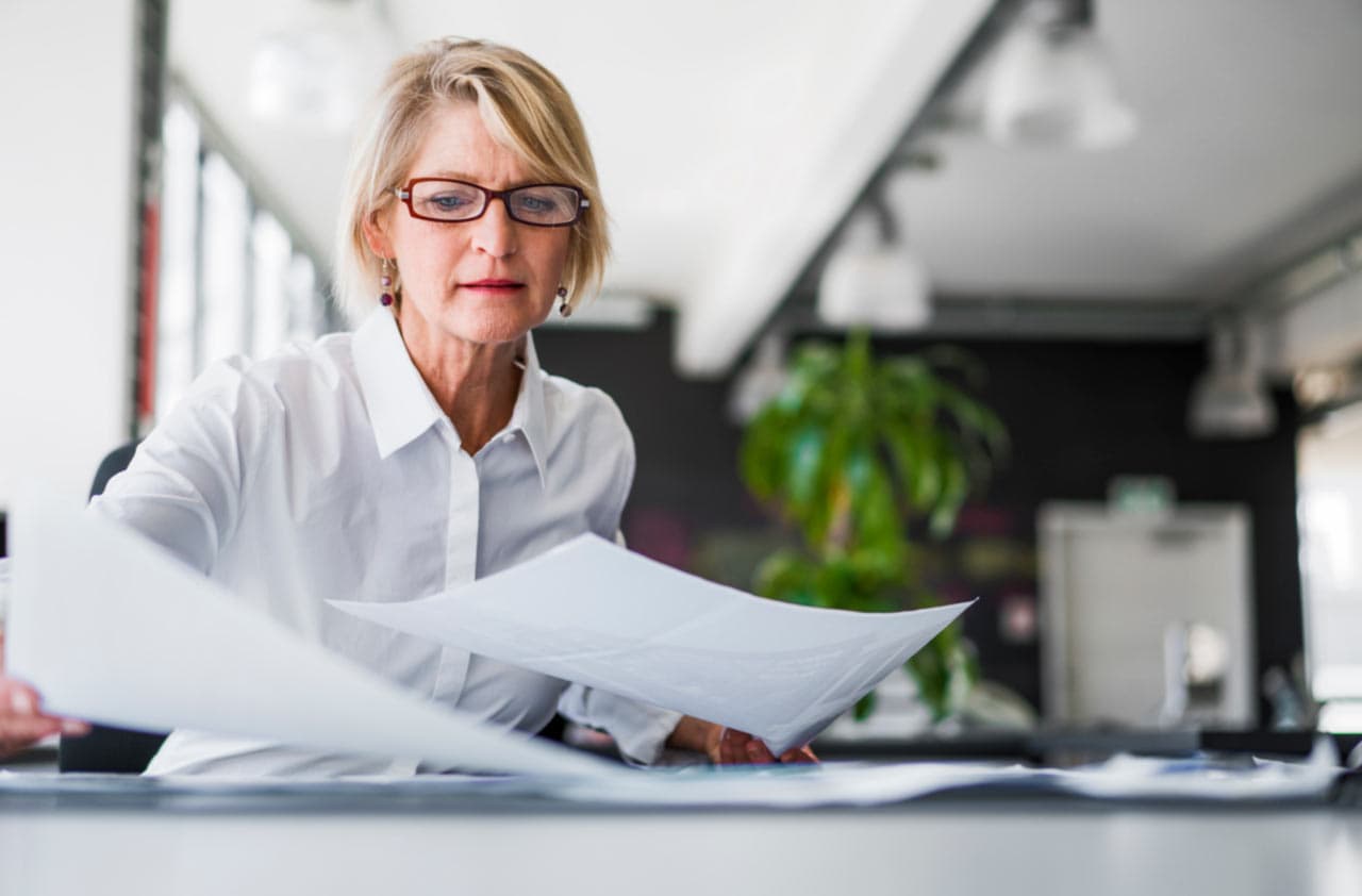 woman arranging paper works