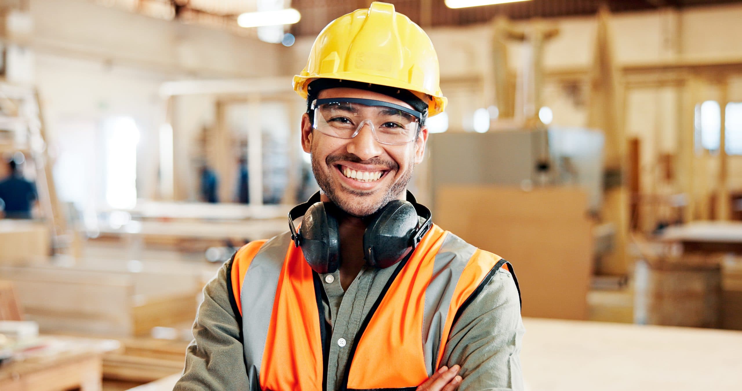 Smiling carpenter in a workshop